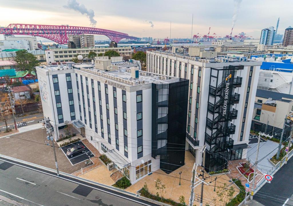 an aerial view of a large white building in a city at Bande Hotel Tenpozan Higashi in Osaka