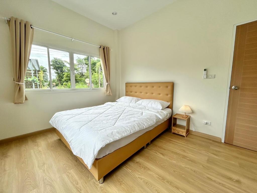 Postel nebo postele na pokoji v ubytování BPN COZY BOX HOUSE