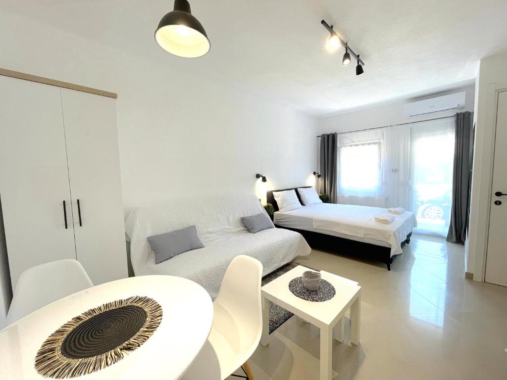 Postel nebo postele na pokoji v ubytování LAGUNA Apartments