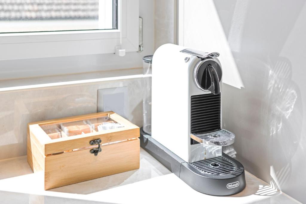 a hair dryer sitting on a counter next to a box at STAYY Flagship Limmattal - contactless check-in in Schlieren
