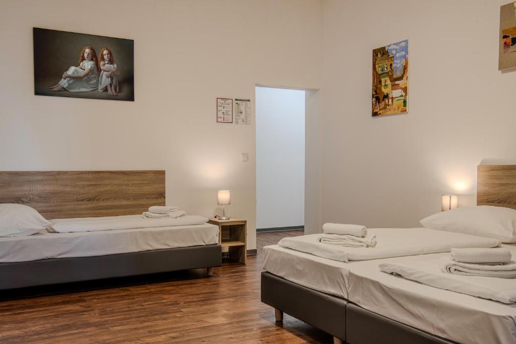 Postel nebo postele na pokoji v ubytování Queens Residenz