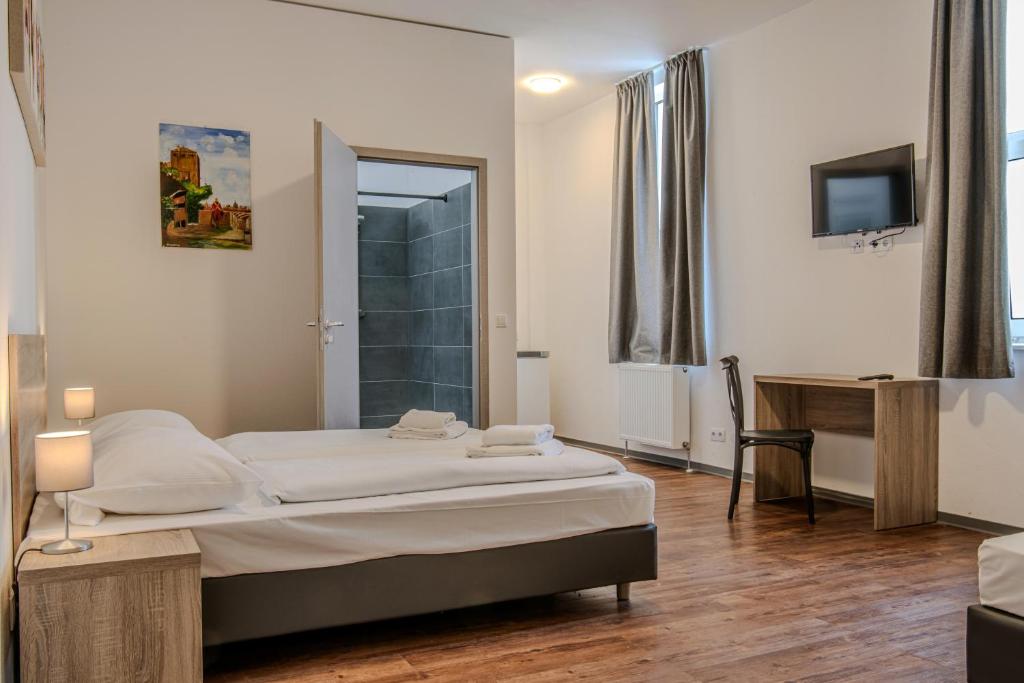 Postel nebo postele na pokoji v ubytování Queens Residenz