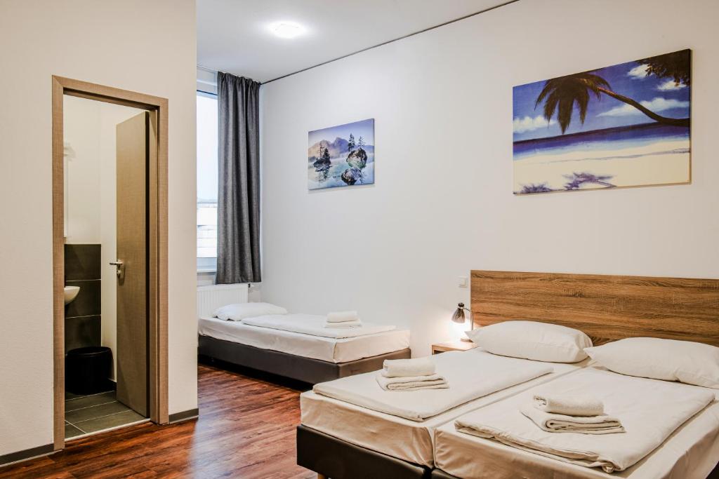 Postel nebo postele na pokoji v ubytování Queens Residenz