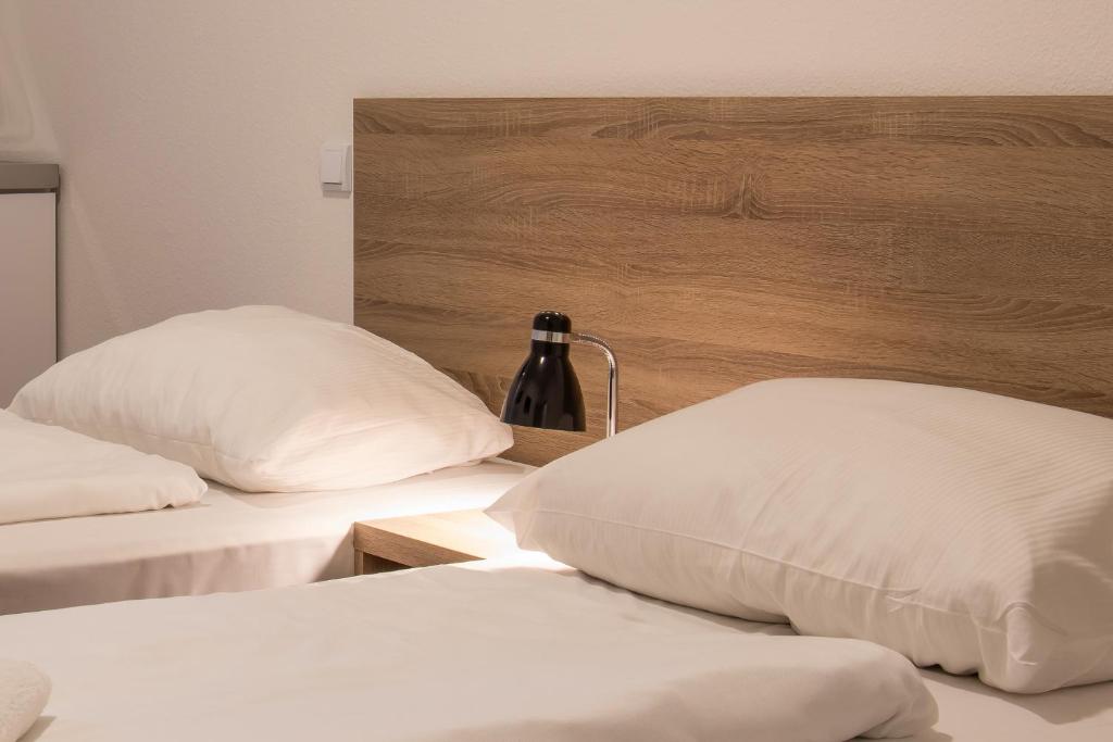 Postel nebo postele na pokoji v ubytování Queens Residenz