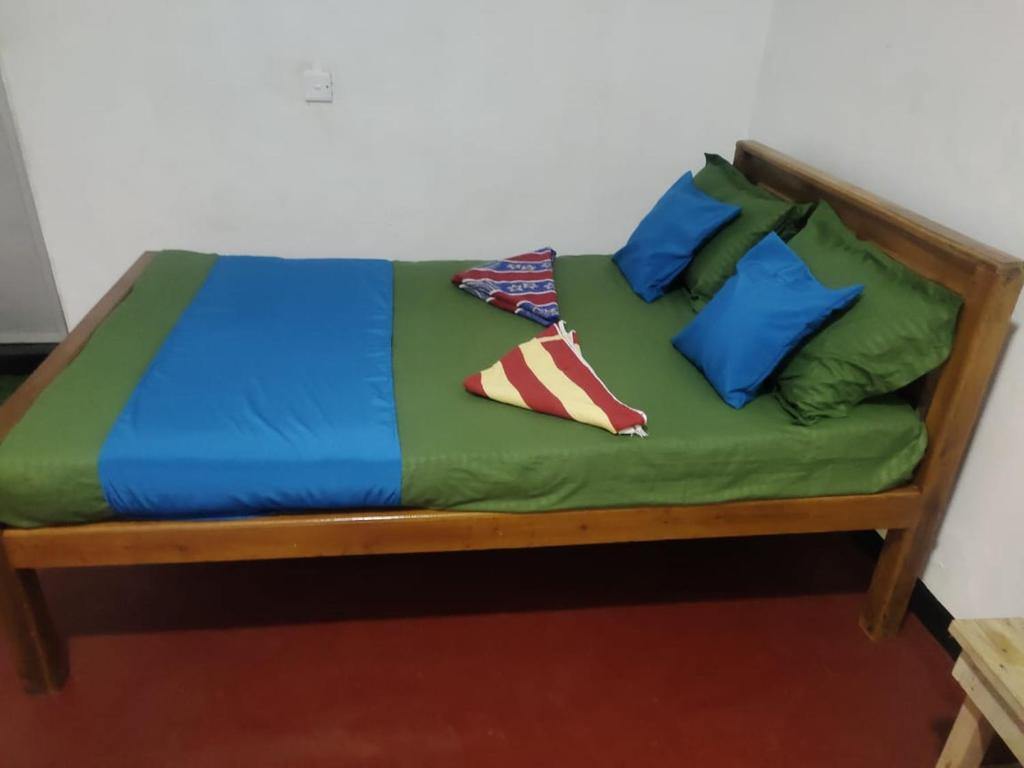 Postel nebo postele na pokoji v ubytování NR Villa Nilaveli
