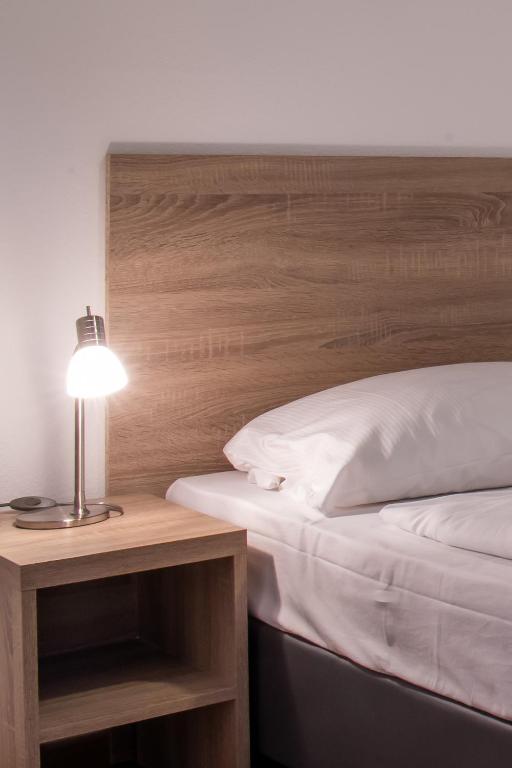 Postel nebo postele na pokoji v ubytování Queens Residenz