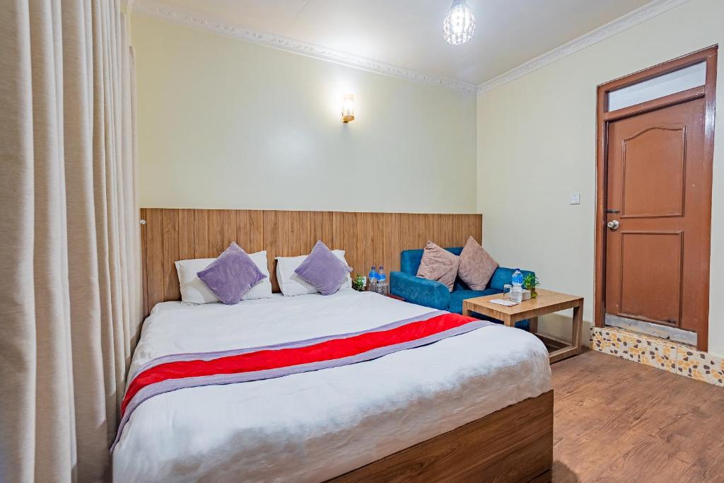 Postel nebo postele na pokoji v ubytování OYO 821 Hotel Gauri