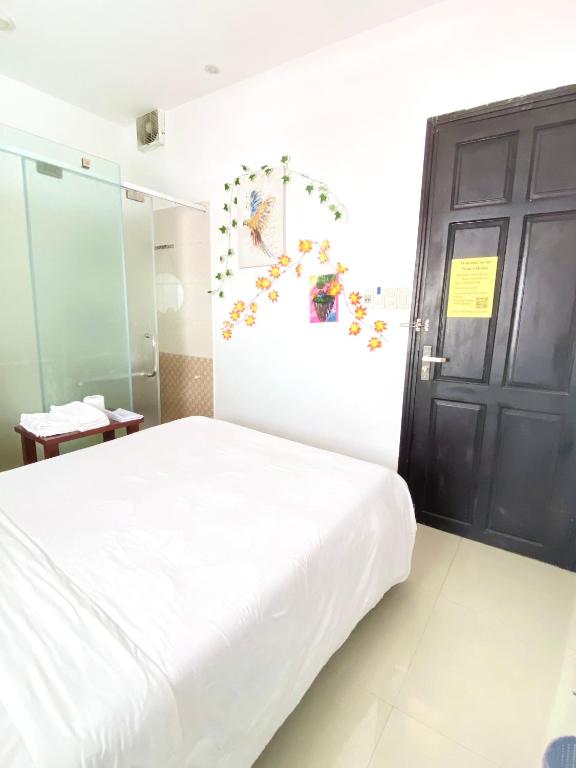 Postel nebo postele na pokoji v ubytování Nem's House Hội An