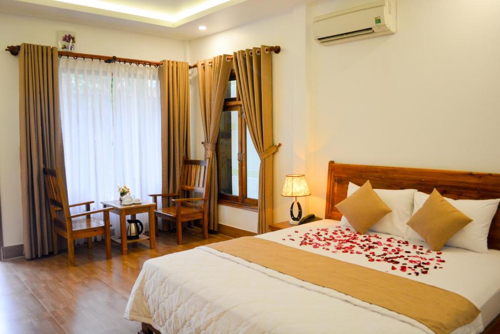 Postel nebo postele na pokoji v ubytování Ngoc Viet Bungalow
