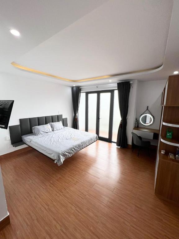 Postel nebo postele na pokoji v ubytování Oasis Homestay