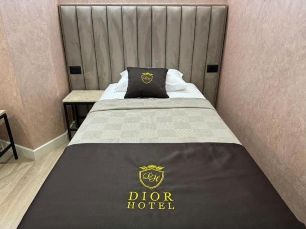 Postel nebo postele na pokoji v ubytování Hotel Dior