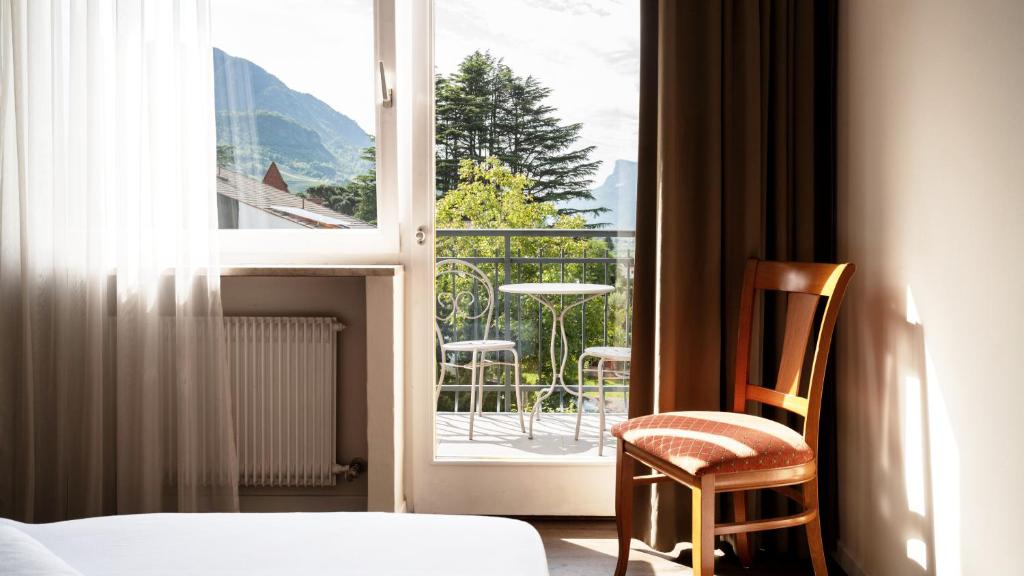 Postel nebo postele na pokoji v ubytování Hotel Villa Laurus