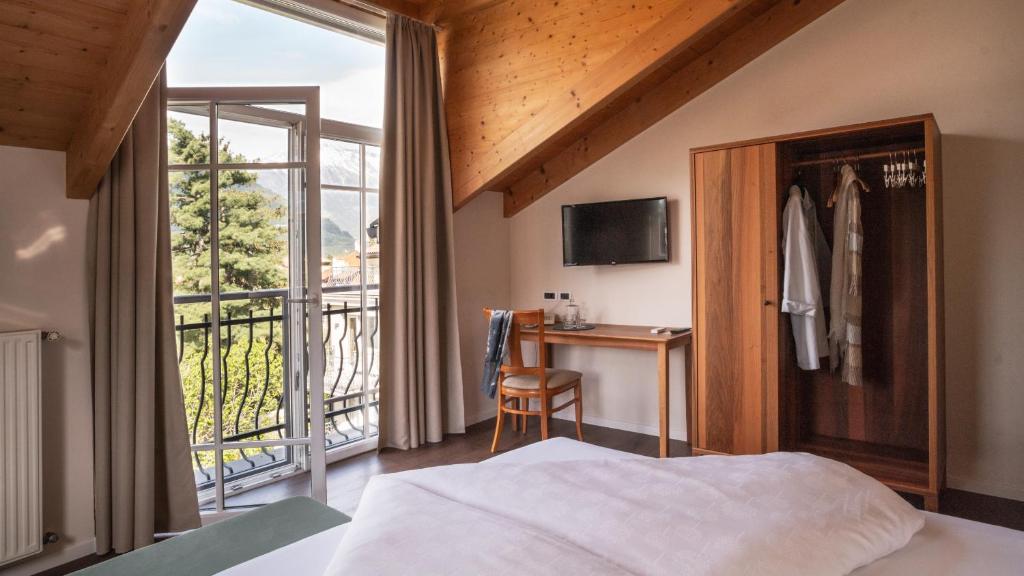 Postel nebo postele na pokoji v ubytování Hotel Villa Laurus