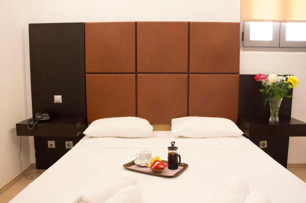 Łóżko lub łóżka w pokoju w obiekcie INOH HOTEL