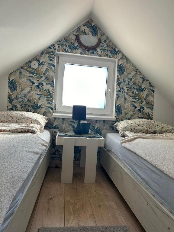 Postel nebo postele na pokoji v ubytování Apartmani Trio