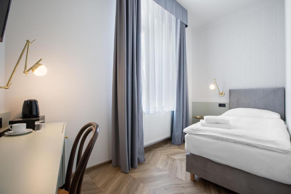 Łóżko lub łóżka w pokoju w obiekcie Hotel Beránek