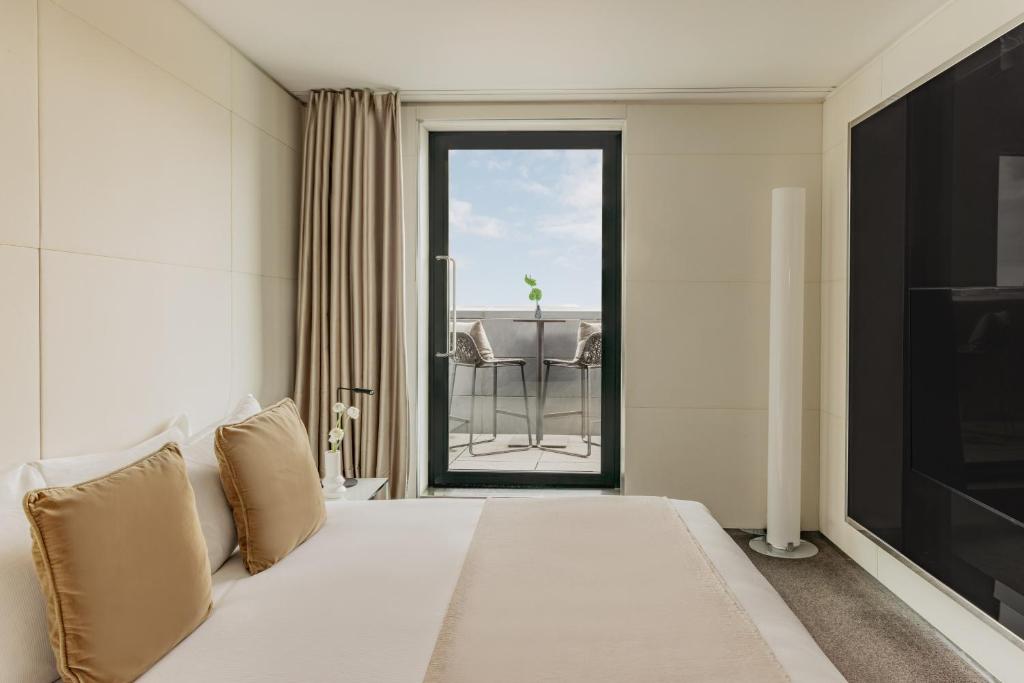 A bed or beds in a room at ME London by Melia - Covent Garden