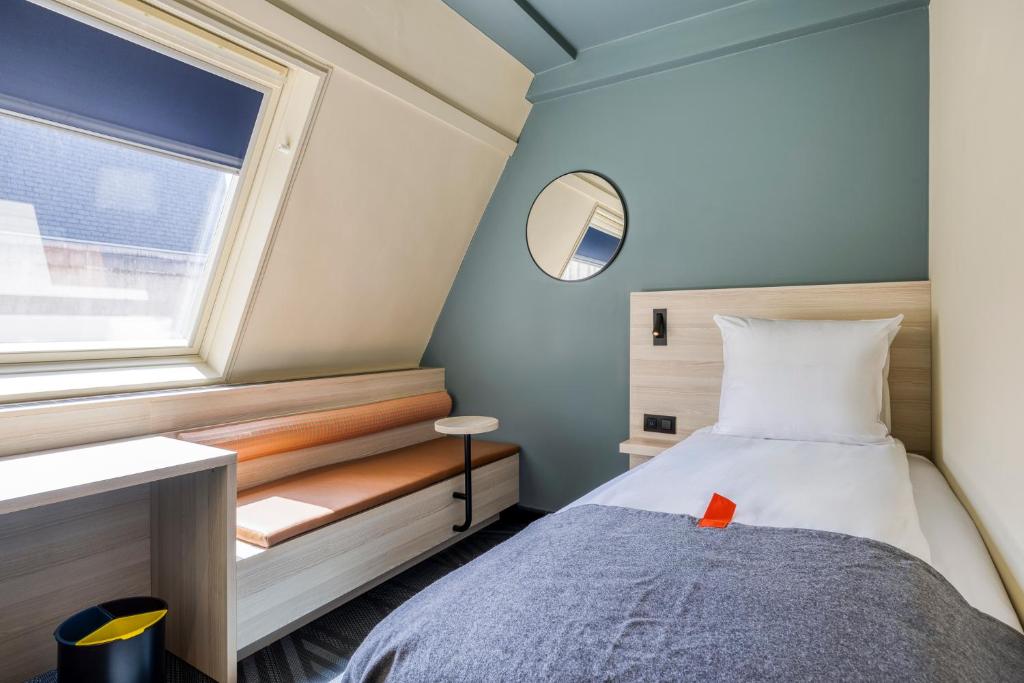 Postel nebo postele na pokoji v ubytování Citybox Brussels
