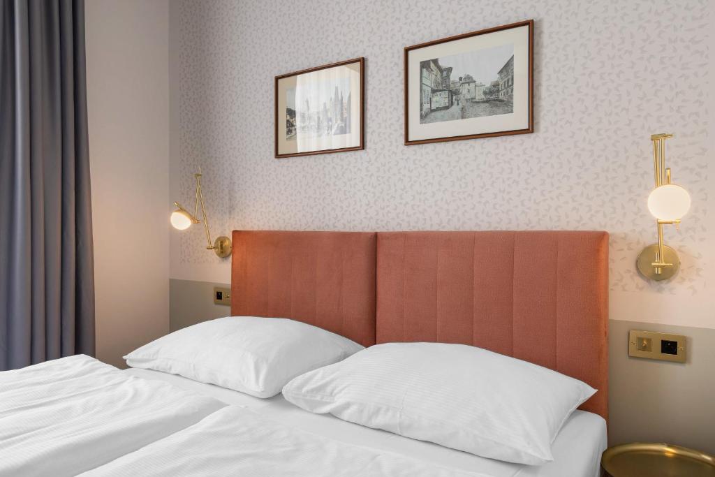 Łóżko lub łóżka w pokoju w obiekcie Hotel Beránek