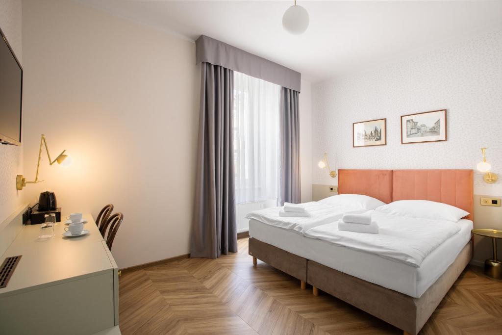 Łóżko lub łóżka w pokoju w obiekcie Hotel Beránek
