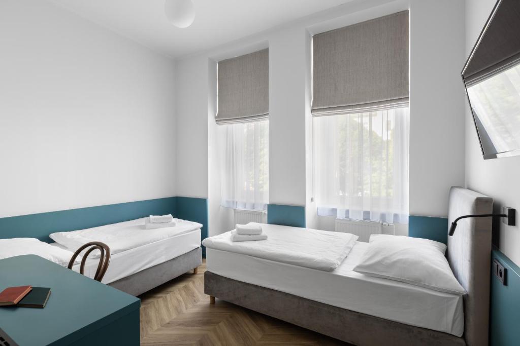 Łóżko lub łóżka w pokoju w obiekcie Hotel Beránek