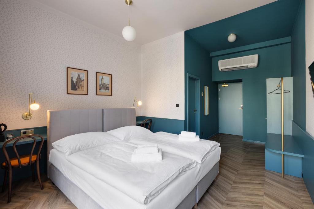 Łóżko lub łóżka w pokoju w obiekcie Hotel Beránek