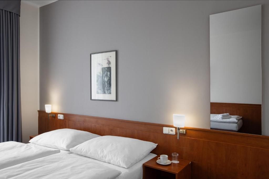Łóżko lub łóżka w pokoju w obiekcie Hotel Beránek