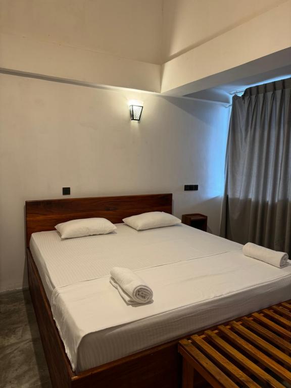 Postel nebo postele na pokoji v ubytování Sky Heaven Hotel