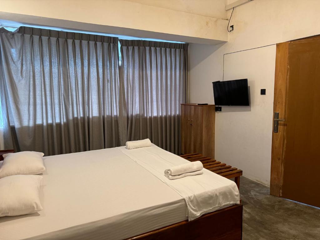 Postel nebo postele na pokoji v ubytování Sky Heaven Hotel