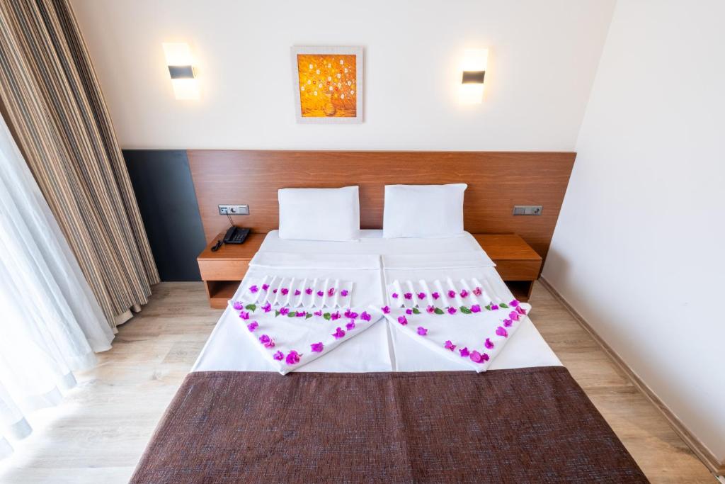 Postel nebo postele na pokoji v ubytování Viking Express Hotel
