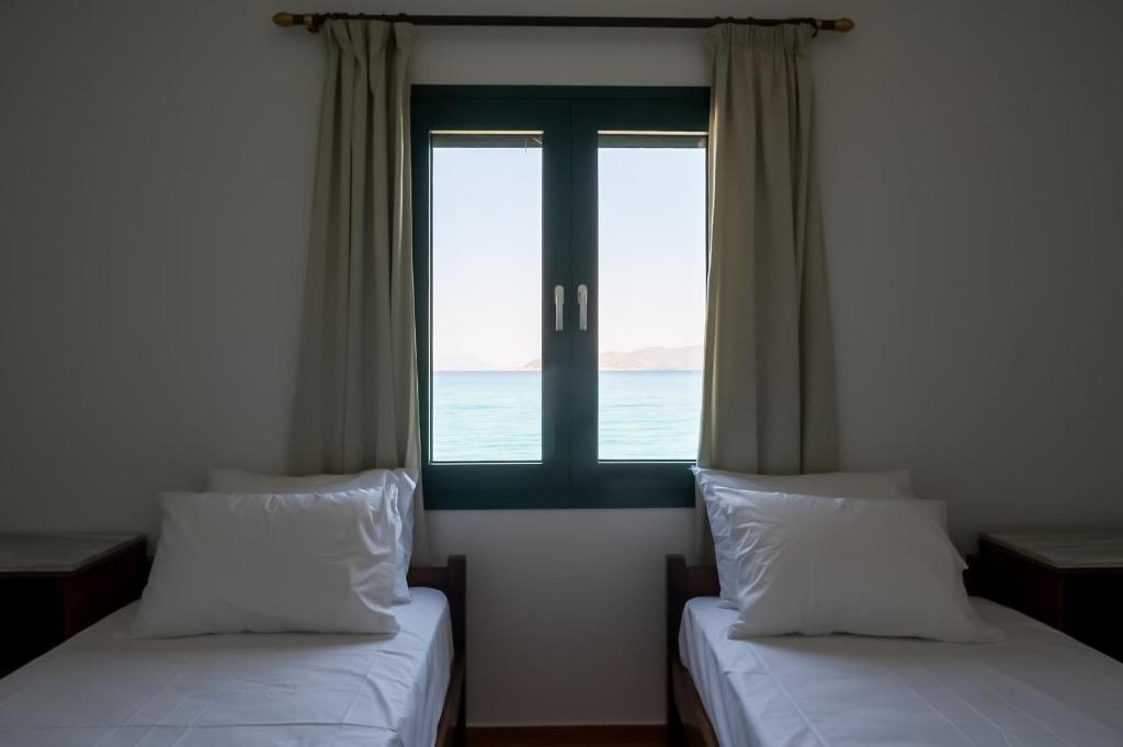 Postel nebo postele na pokoji v ubytování Beachfront Oasis