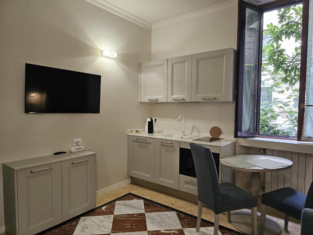 Kuchyň nebo kuchyňský kout v ubytování Andreola Central Hotel