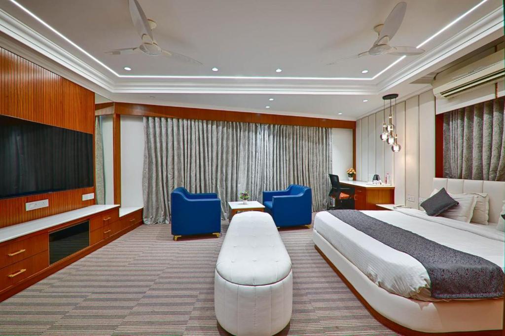 Postel nebo postele na pokoji v ubytování HOTEL SHITAL INN