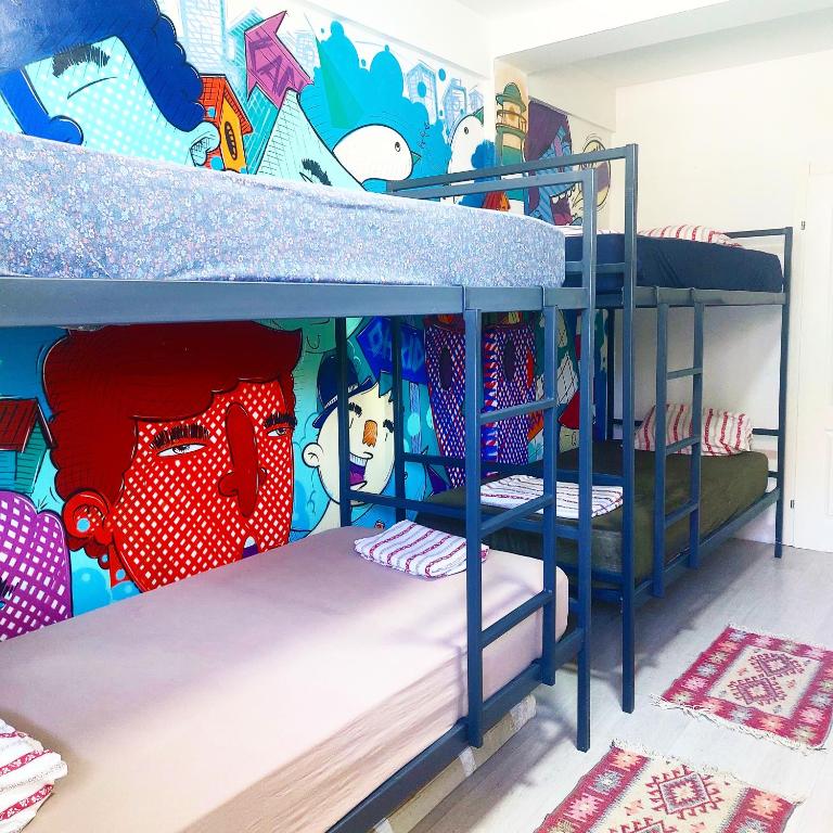 Postel nebo postele na pokoji v ubytování Golden Age Hostel