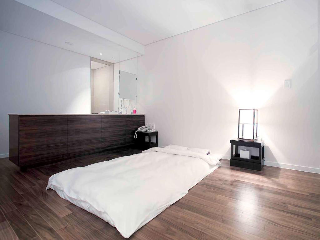 Postel nebo postele na pokoji v ubytování Grand Mercure Ambassador Changwon