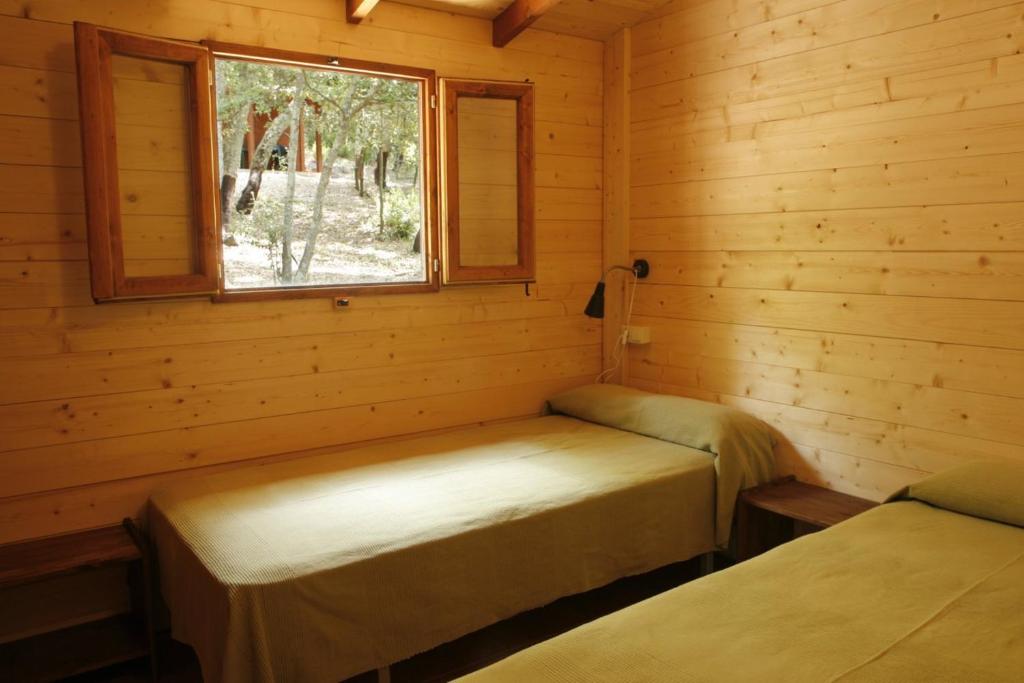 Postel nebo postele na pokoji v ubytování Camping Maçanet de Cabrenys