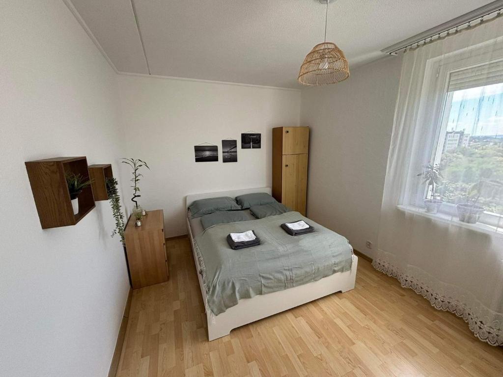 Ένα ή περισσότερα κρεβάτια σε δωμάτιο στο Cosy Family Home