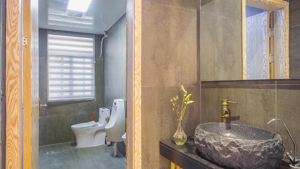 Koupelna v ubytování Dashe Yuanye Boutique Homestay
