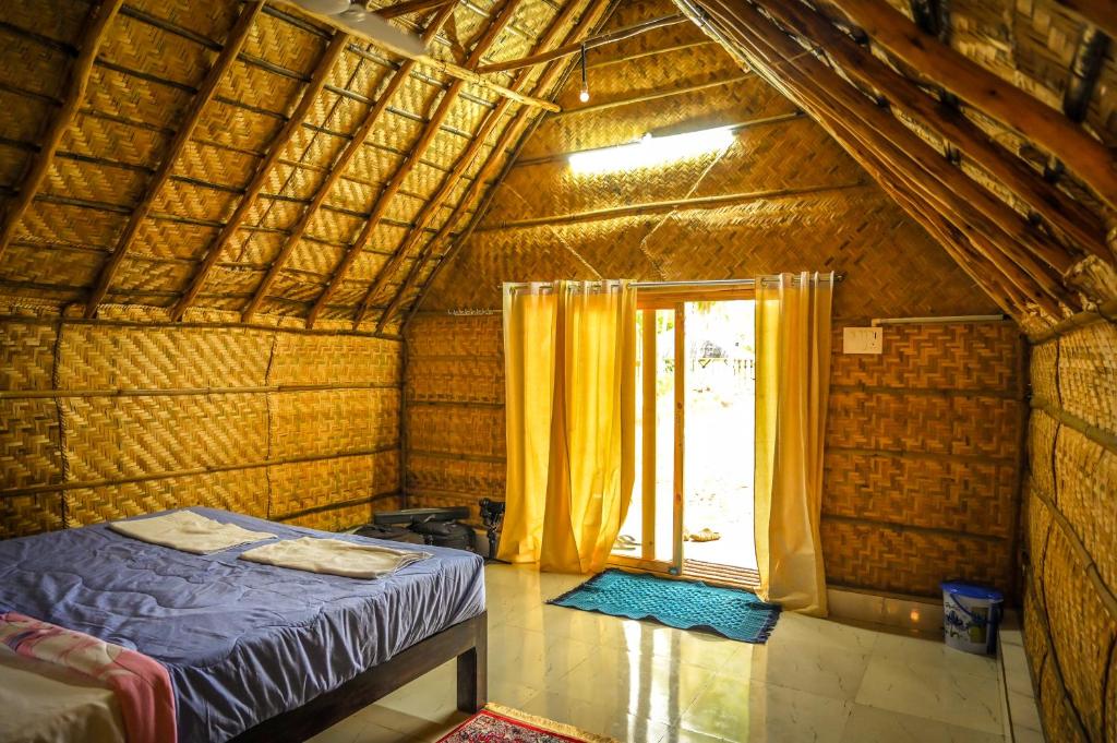 Katil atau katil-katil dalam bilik di Tamarind Tree Way Side Amenities