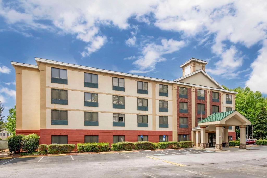 a large building with a clock tower on top at Comfort Inn Alpharetta-Atlanta North in Alpharetta