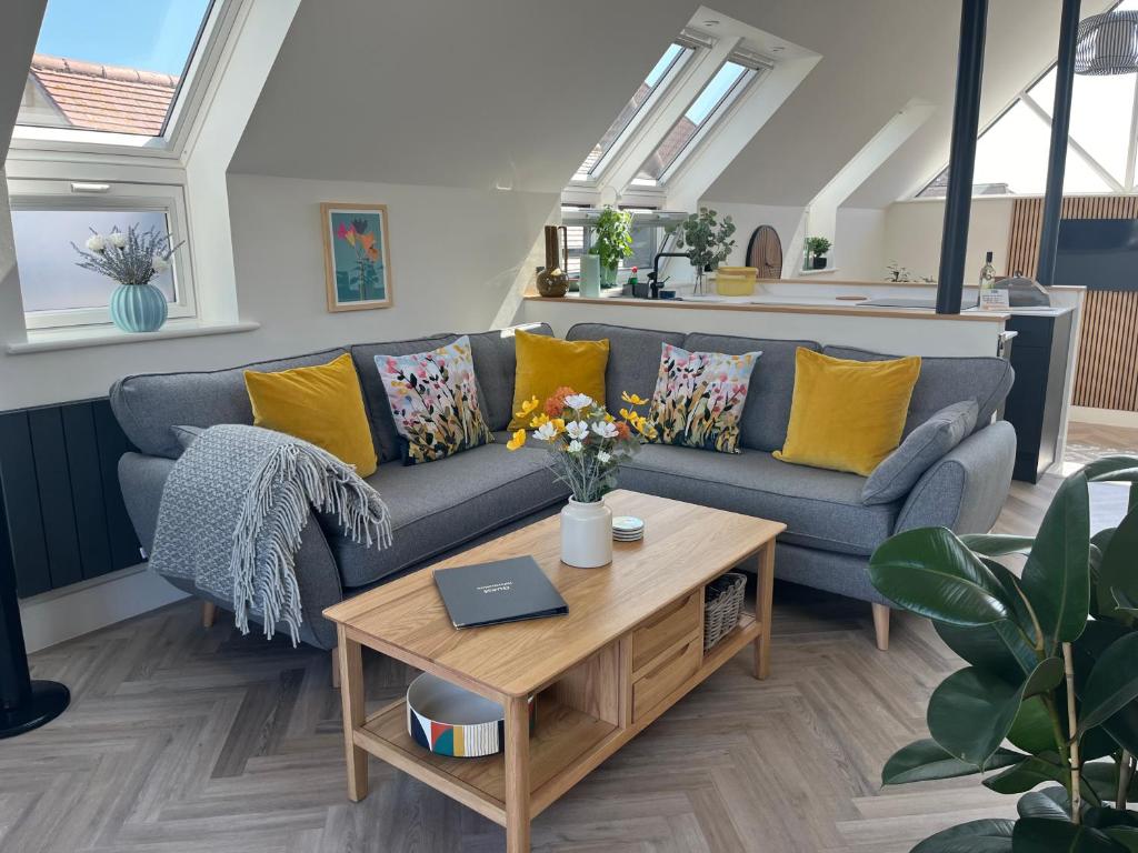 a living room with a couch and a coffee table at The Pines Hotel in Swanage