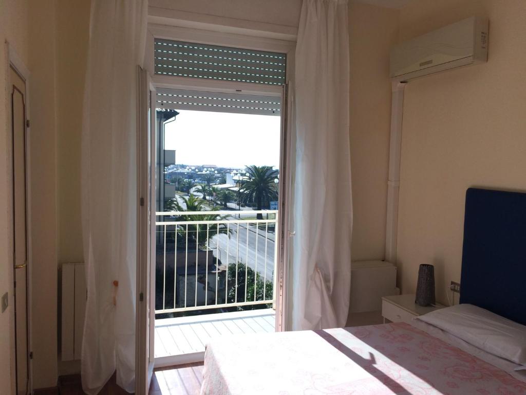 Postel nebo postele na pokoji v ubytování Hotel Mirage