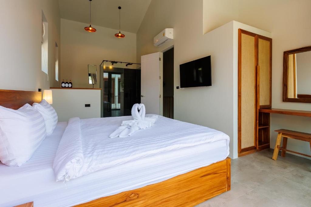 Postel nebo postele na pokoji v ubytování ZiVilla Private Pool Beachfront