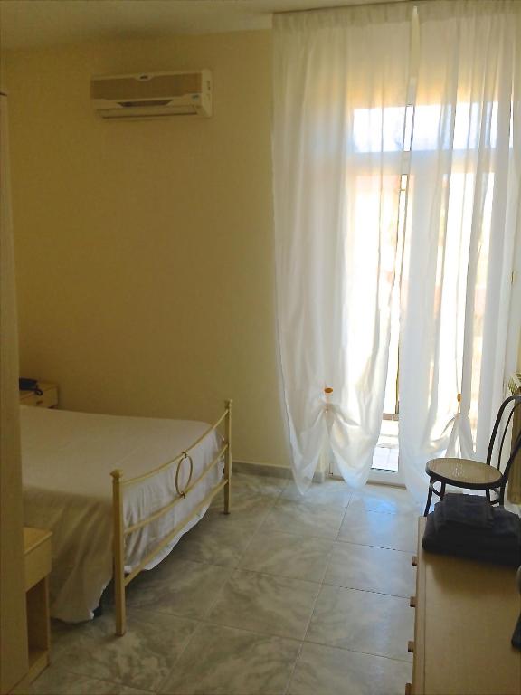Postel nebo postele na pokoji v ubytování Hotel Mirage