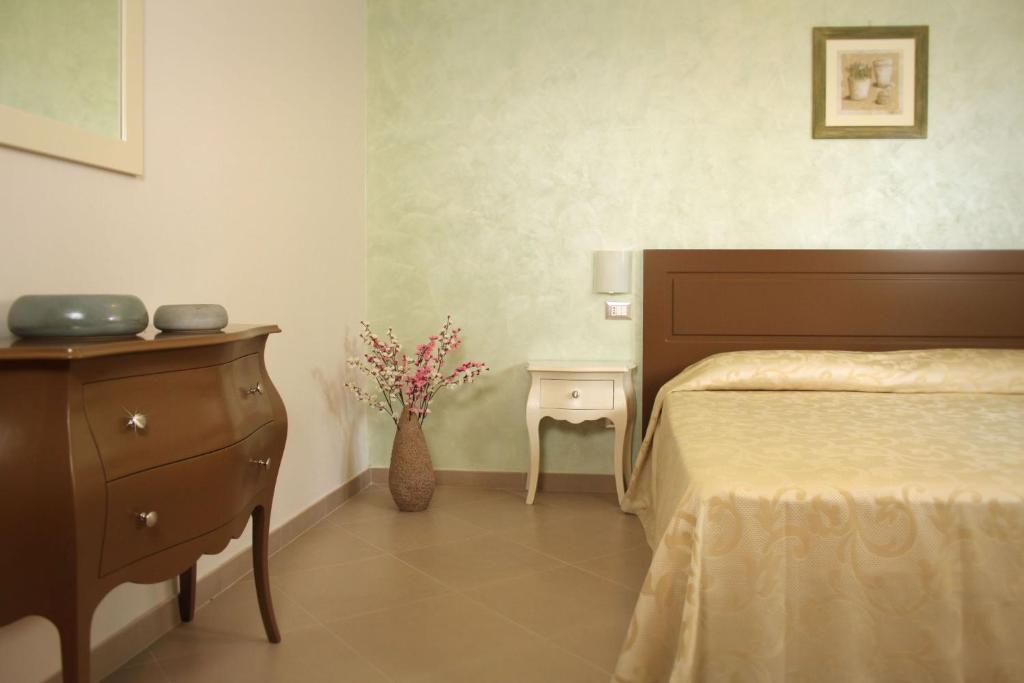 Postel nebo postele na pokoji v ubytování Residence San Nicola
