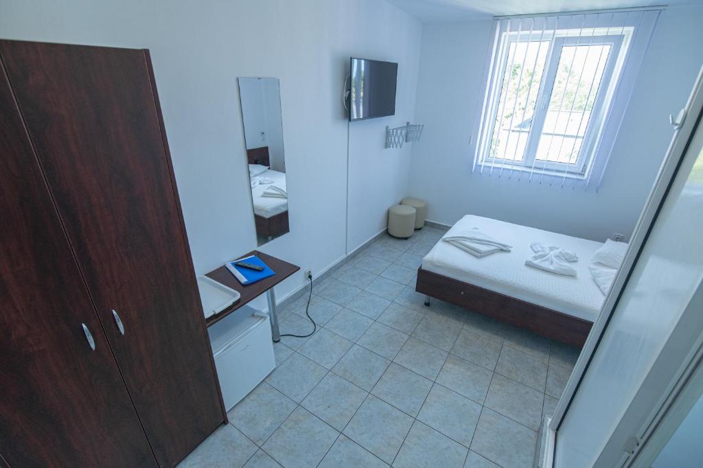 Postel nebo postele na pokoji v ubytování Hotel Proton