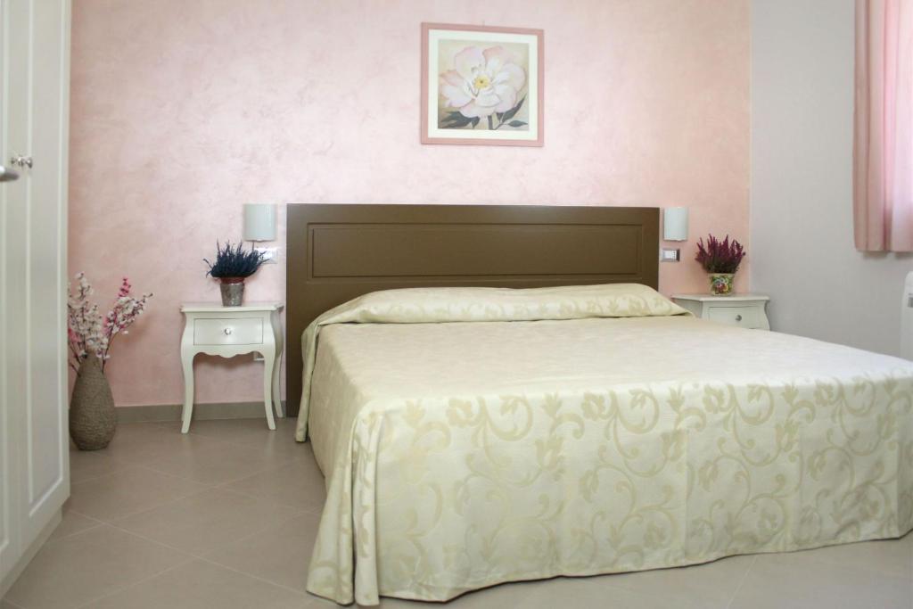 Postel nebo postele na pokoji v ubytování Residence San Nicola