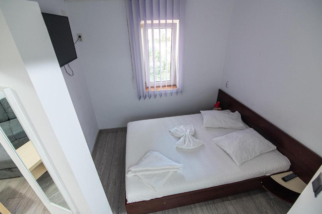 Postel nebo postele na pokoji v ubytování Hotel Proton