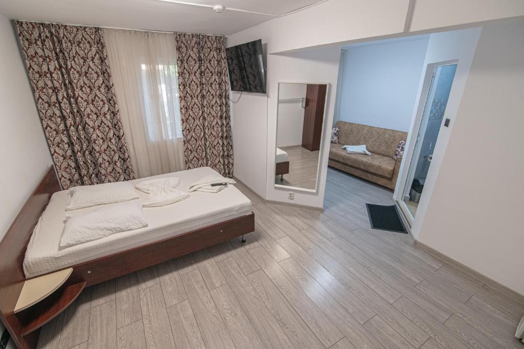 Postel nebo postele na pokoji v ubytování Hotel Proton