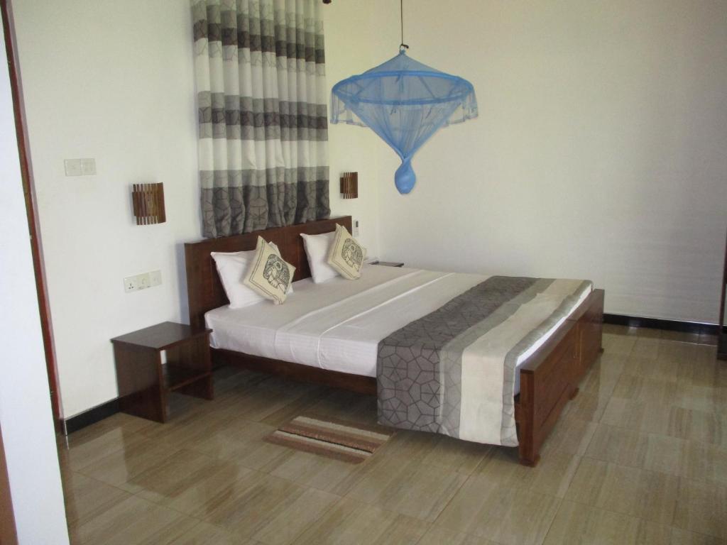 Postel nebo postele na pokoji v ubytování Peacock Lake Villa